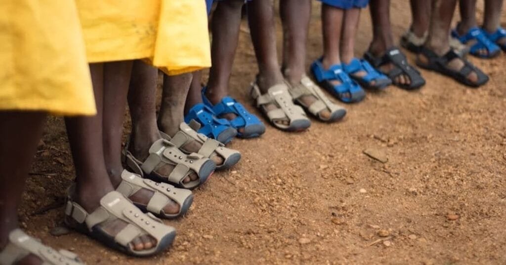 People wearing shoes in an endemic area